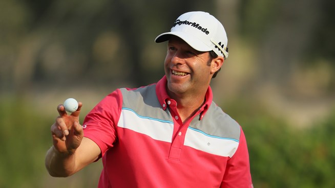 Dredge leads in Doha