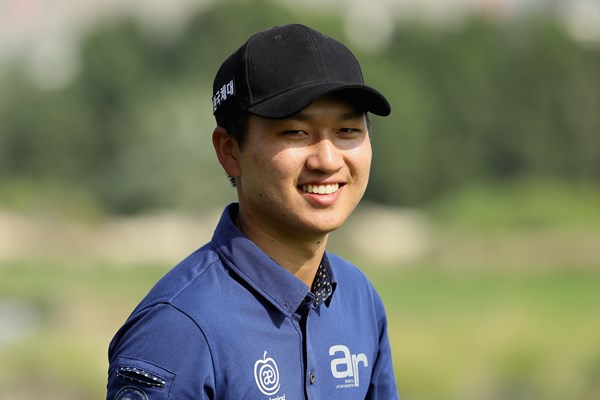 Wang emerges from leaderboard log jam to lead by three in Qatar