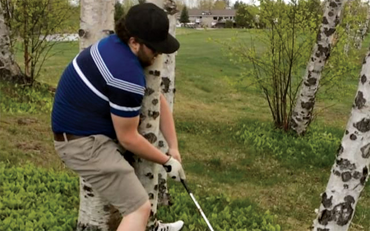 Watch this golfer get REALLY creative to hit a shot from a tough spot