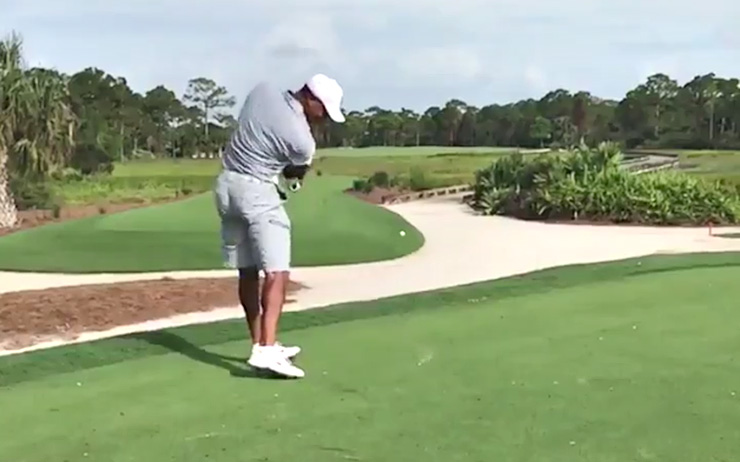 Tiger Woods posts slow-mo video of him hitting his patented “stinger”