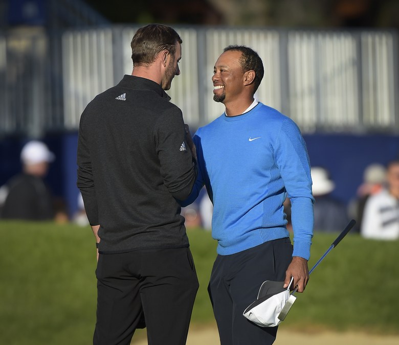 Dustin Johnson lets Tiger Woods know who’s boss in terms of driving distance