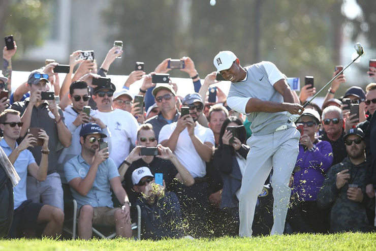 Tiger Woods shoots 70 in the Farmers Insurance Open, while describing his round as gross