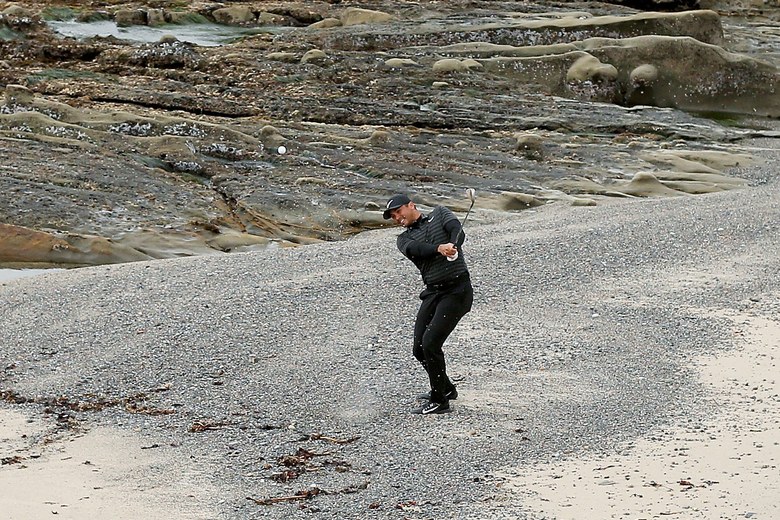Watch Jason Day make a ridiculous par from the pebble beach along Pebble Beach’s 18th hole