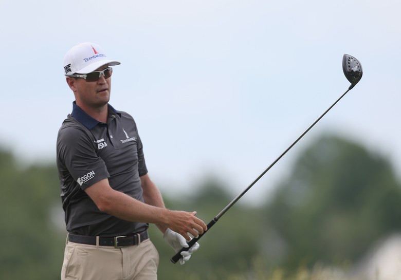 Zach Johnson incurs penalty when ball hangs on lip for longer than 10 seconds before dropping