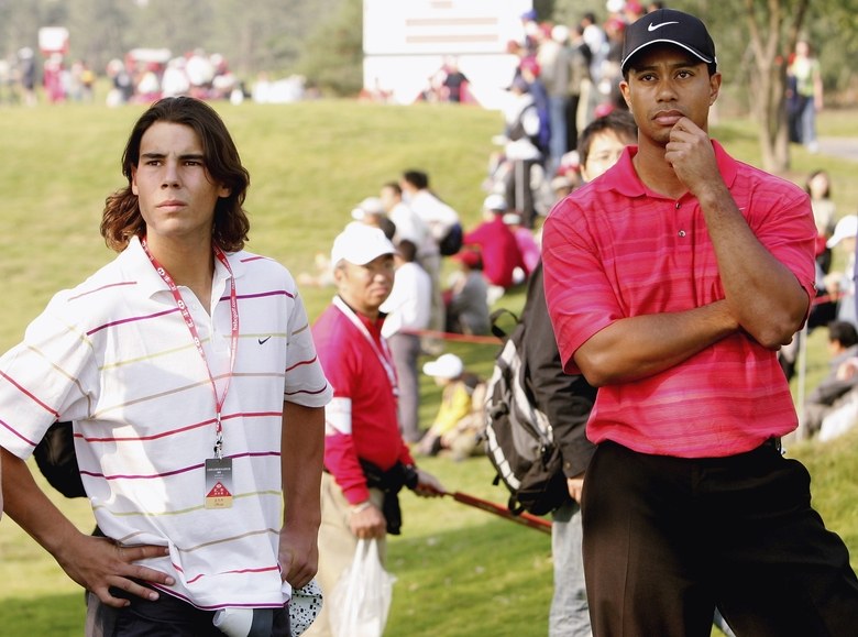 Rafael Nadal is all of us checking on Tiger Woods’s final round during Rogers Cup match