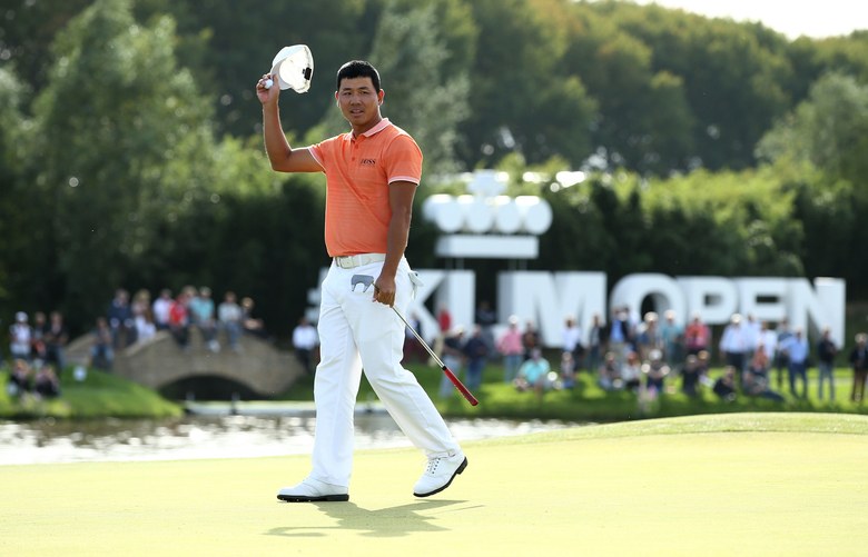 China’s Ashun Wu rallies late to salvage 2018 season and win KLM Open by one over Chris Wood