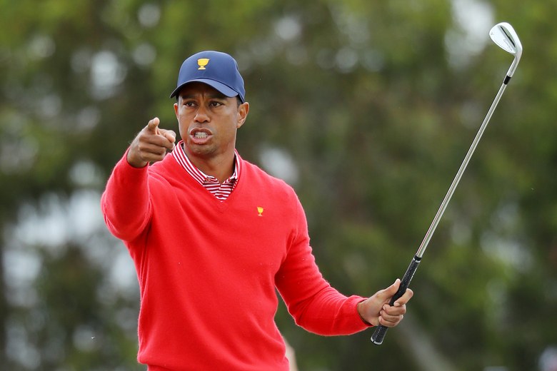 Tiger makes six birdies, helps secure lone U.S. point on disappointing Day 1 for Americans