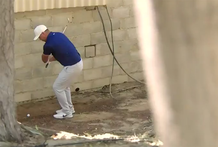 The cameraman who stood in a dangerous spot to film this Brooks Koepka punch shot deserves a raise