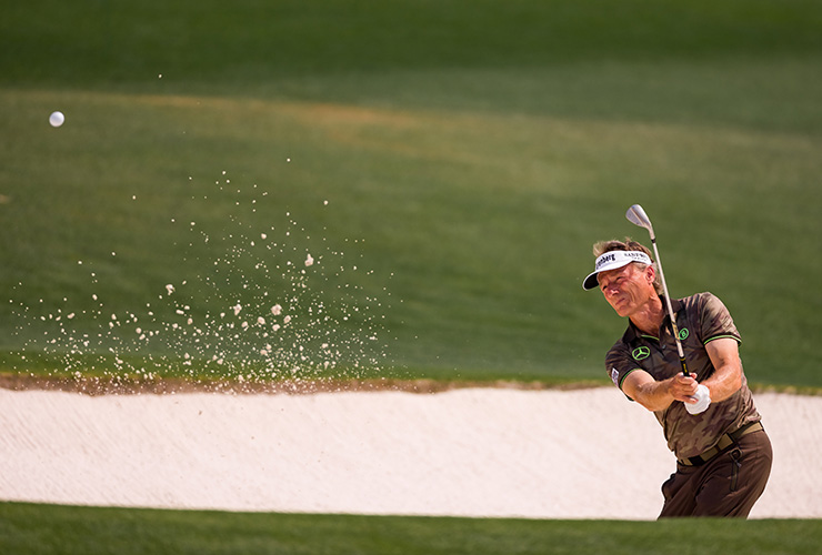 Two-time champion Bernhard Langer drives smoothly on despite vast distance disadvantage