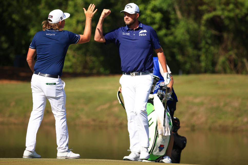 Watch Marc Leishman chip-in for birdie, then hilariously botch the high-five celebration with Cam Smith
