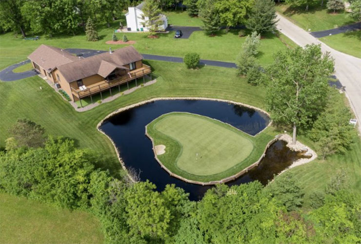 LOOK: House with ridiculous backyard replica of TPC Sawgrass’ famed 17th hole goes on the market