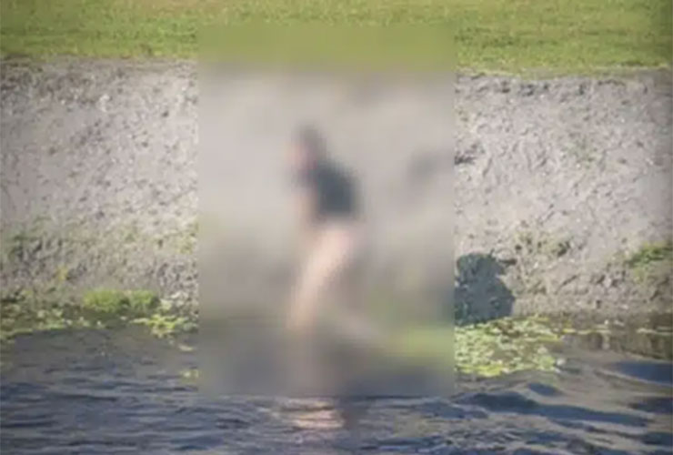 Golfer strips down and risks life and limb to play his wayward tee shot