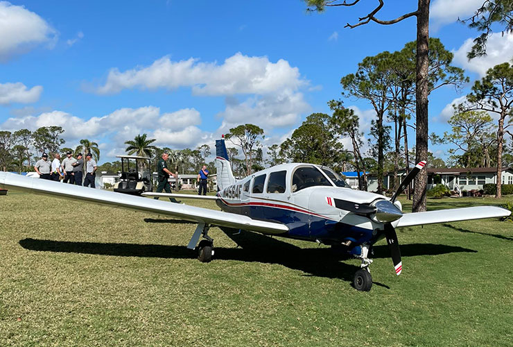 LOOK: Plane forced to make emergency landing on golf course, golfers push it off green so they can finish the hole