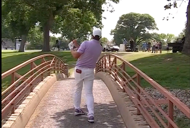 Michael Block can’t stop hitting ridiculous golf shots, stripes one off a gravel bridge