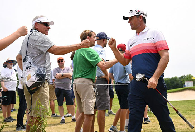 WATCH: Padraig Harrington drills spectator with tee shot, gives him wad of $50s to make up for it
