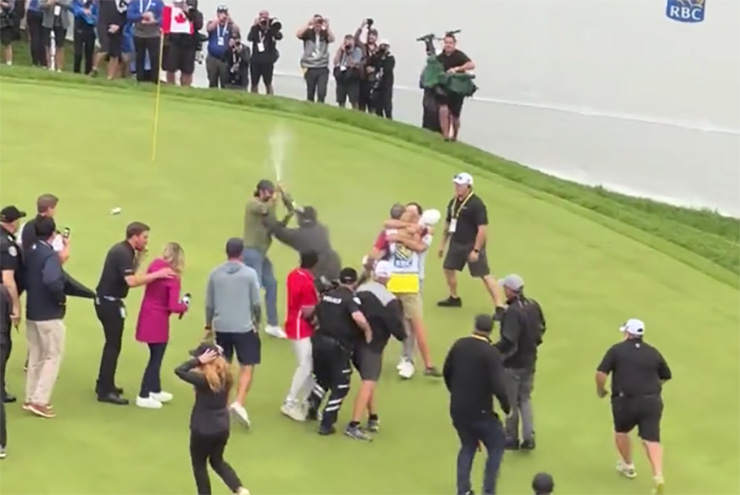 Watch Adam Hadwin get FLATTENED by a security guard while trying to celebrate fellow Canadian Nick Taylor’s epic win