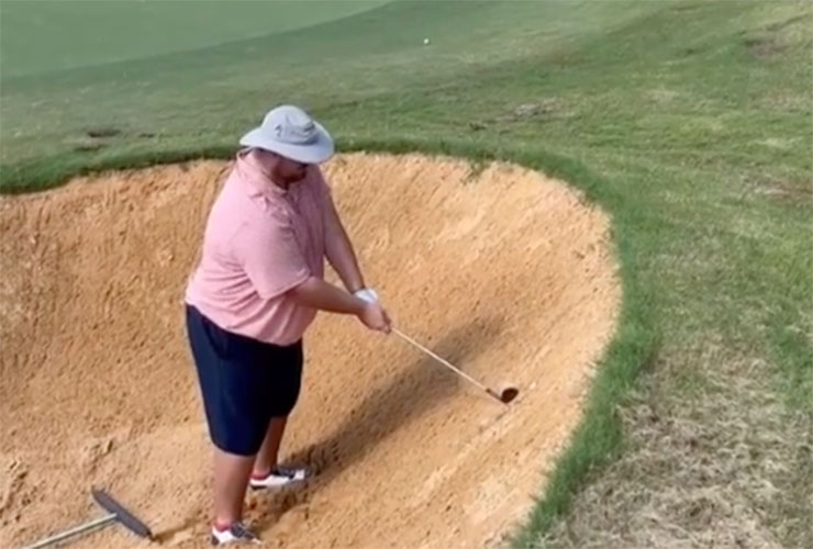 The only thing better than this guy’s amazing buried bunker shot was the celebration