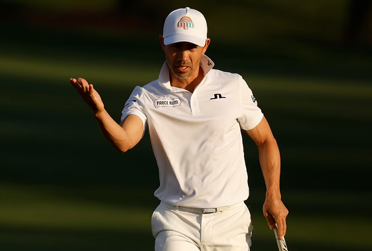 A timely phone call from a half-a-world has Camilo Villegas surprisingly atop the Players leaderboard